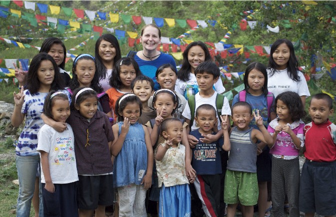Students of the C.E.D. Institute gathered under prayer flags in Northern India